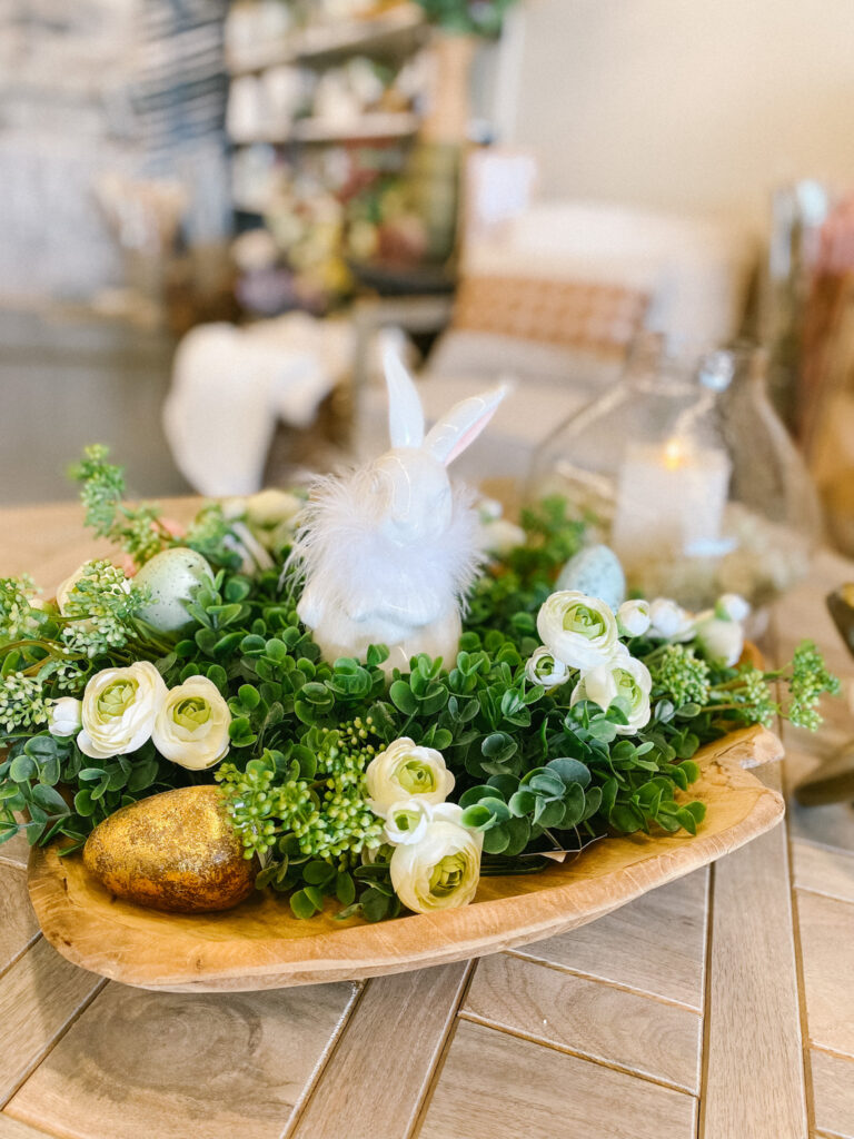 image of bowl with greenery, eggs, a bunny and flowers decorated for spring